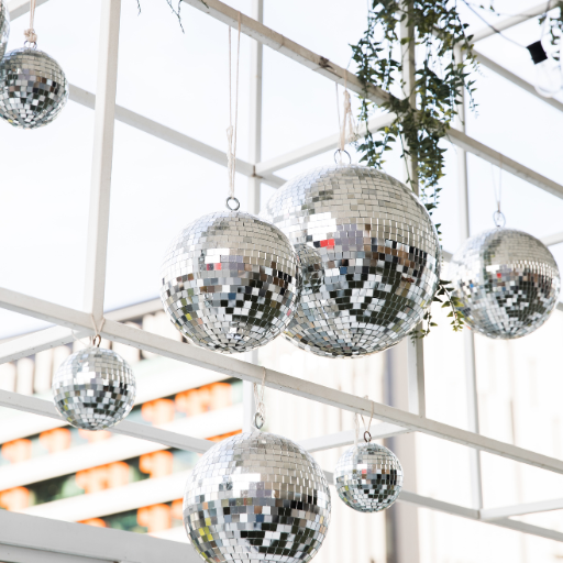 Disco balls hanging with leaves